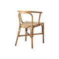 Naturalne krzesło rattanowe Riviera o lekkiej, eleganckiej formie i ręcznie plecionym siedzisku. Produkt dostępny w Ulica Ceramiczna & Home Design.