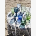 Szklanka Madam Stoltz z recyklingowanego szkła w jasnozielonym kolorze to stylowy dodatek do stołu, dostępny w Ulica Ceramiczna & Home Design.
