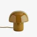 Lampa stołowa Madam Stoltz w kolorze ciemnej musztardy to stylowy i przytulny element oświetlenia, dostępny w Ulica Ceramiczna & Home Design.